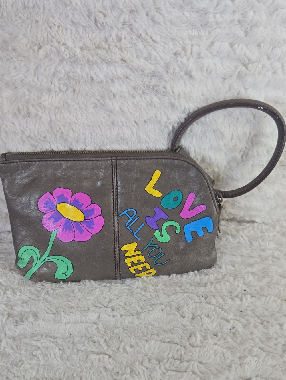 HOBO Gray Wristlet with Colorful Flower and 'LOVE IS ALL YOU NEED' Design